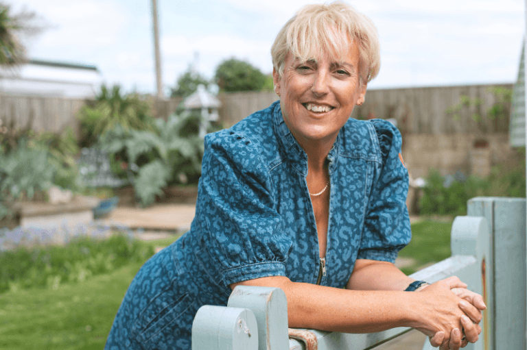 Jacqui Flavell leaning on gate